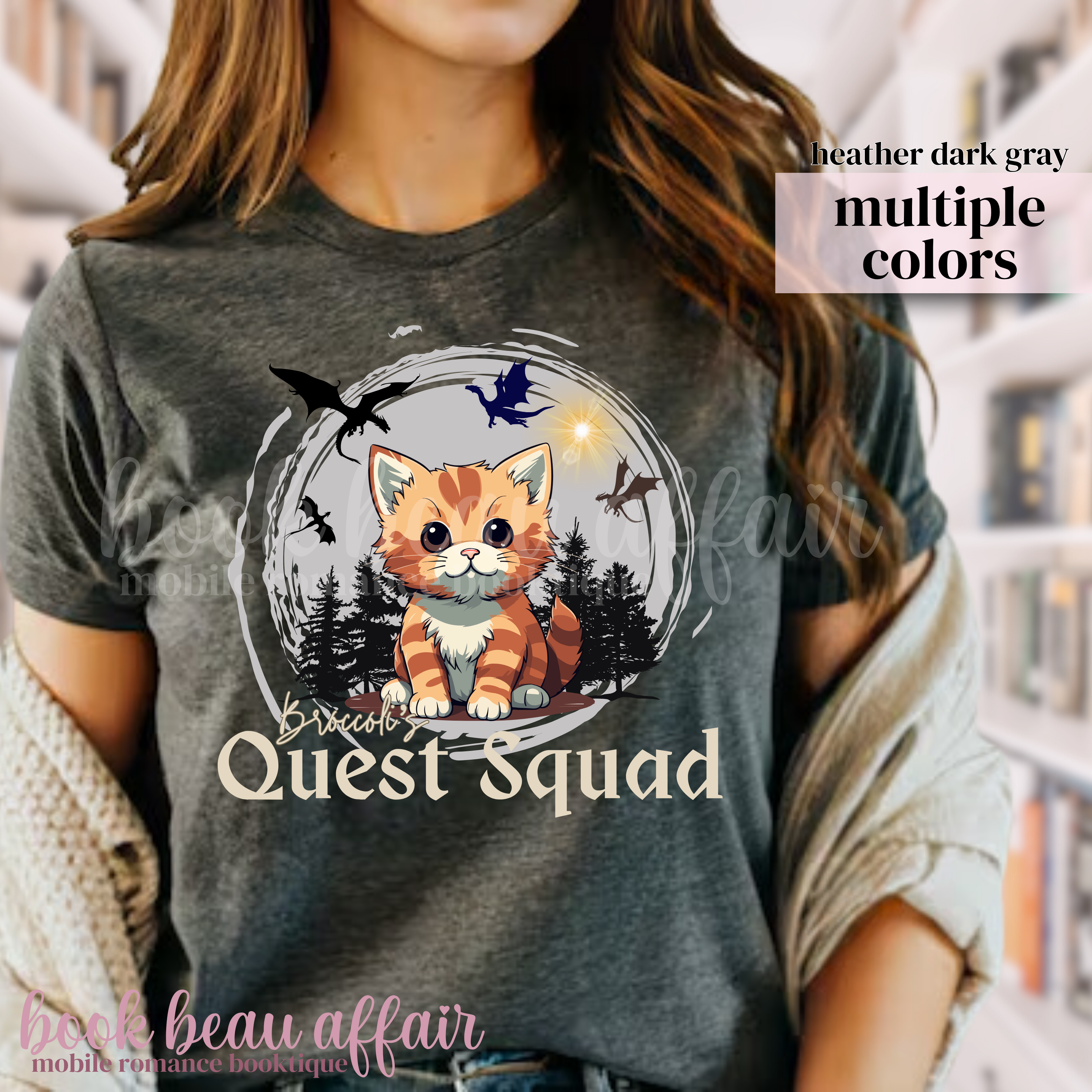t-shirt with dragons and an orange tabby cat that says "Broccoli's Quest Squad"