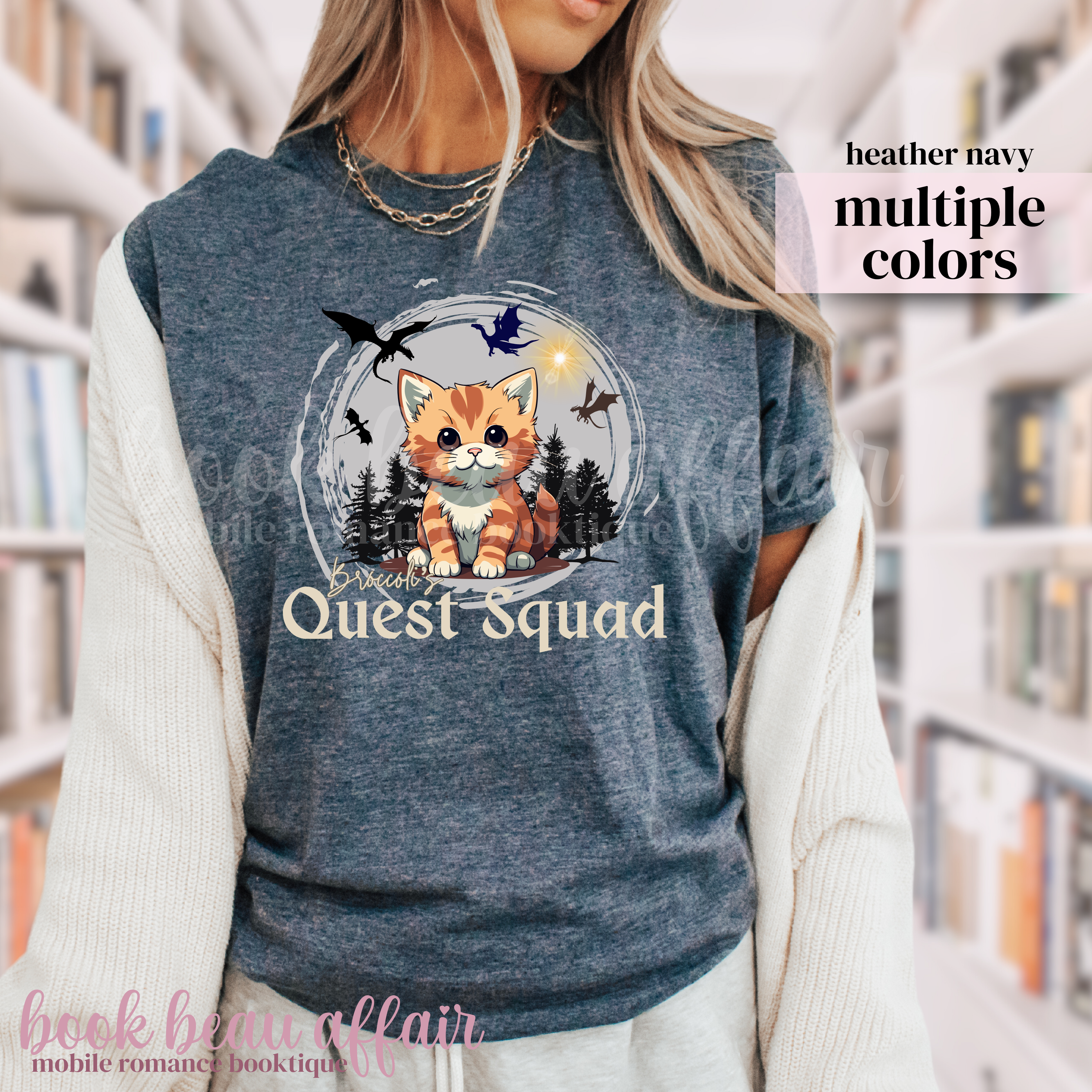 t-shirt with dragons and an orange tabby cat that says "Broccoli's Quest Squad"