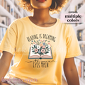 T-shirt that says "reading is dreaming with your eyes open"